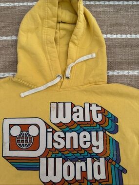 Disney yellow Pullover with Blue vintage like Logo.long sleeve like new.